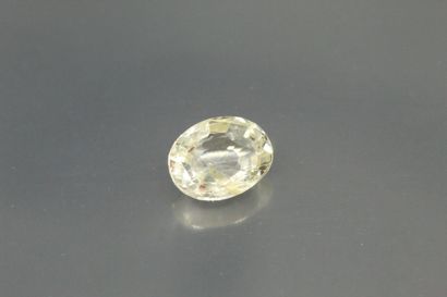 null Colorless/yellow oval sapphire on paper.

Accompanied by a GFCO certificate...