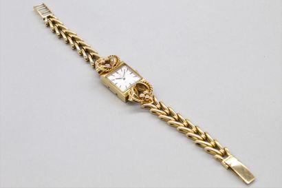 null OMEGA 

Montre bracelet de dame, boîtier carré en or jaune 18k (750), cadran...