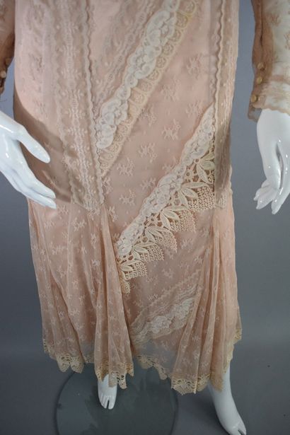 null ANONYMOUS



Dress composed of two elements including a salmon-colored lace-trimmed...