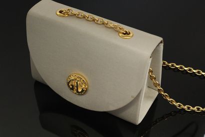 null GUY LAROCHE 

Circa late 1970



Miniature bag covered with greige fabric and...