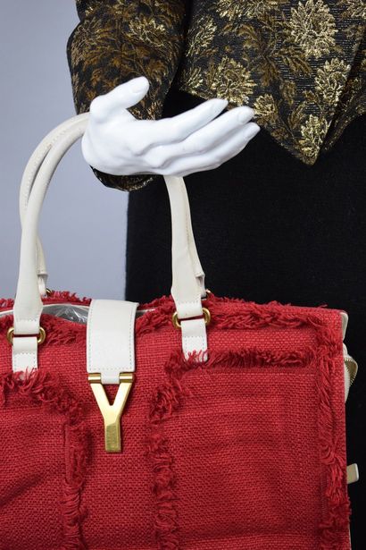 null YVES SAINT LAURENT 



Handbag model "Chyc" in beige leather and red tweed,...