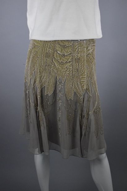 null 
RALPH LAUREN 









Ruffled skirt in chiffon richly embroidered with pearls,...