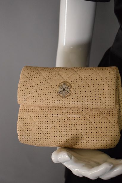 null CHANEL 



Prototype clutch bag in perforated powdered leather with flap and...
