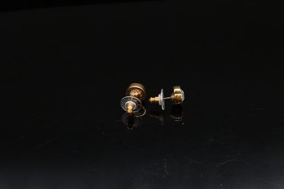 null DANIEL SWAROVSKI 



Pair of golden rhinestone ear studs. 



Signed with a...