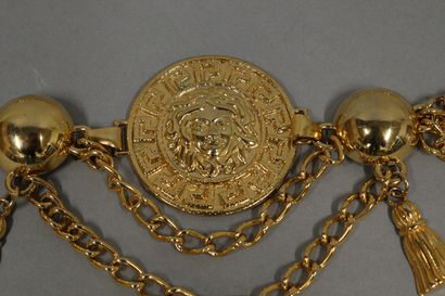 null 
VERSACE (in the style of)

Circa 1980

Gilded metal belt featuring a medusa...