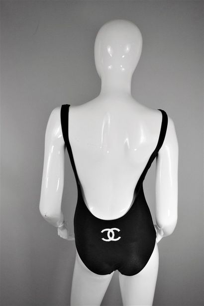 null 
CHANEL



Circa the end of 1990








Black one-piece swimsuit with white...