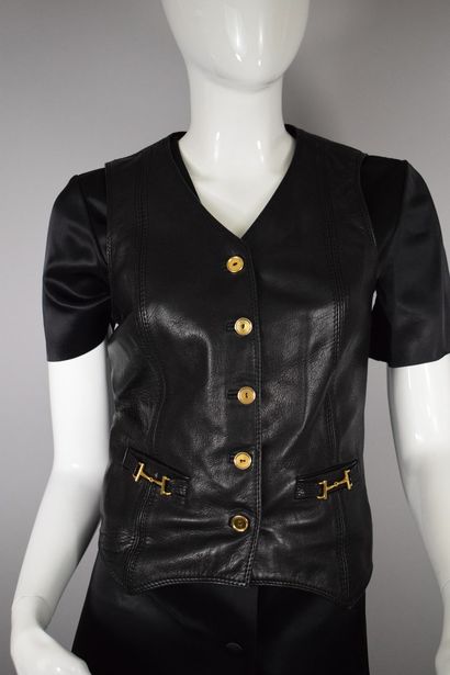 null CELINE 

Circa 1980



Leather bartender vest with gold jewelry. 

Decorated...