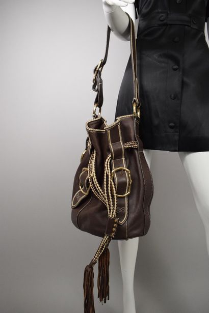 null LANCEL 



Off-white and chocolate leather bucket bag with fringed drawstring...