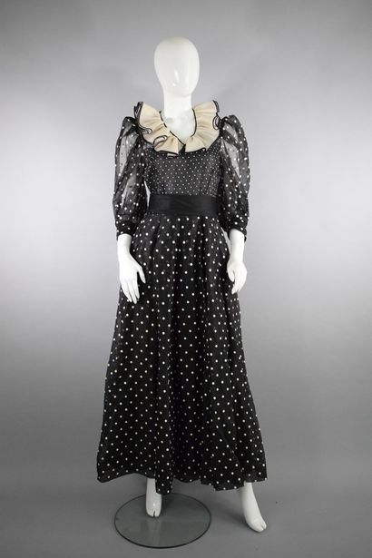 null RETY

Circa 1980



Black dress with small and large white polka dots and large...