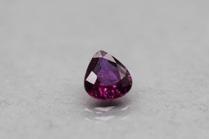 null Pear pink sapphire on paper.

Accompanied by an AIG certificate indicating unheated....