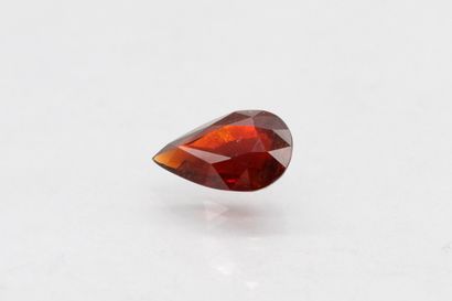 null Pear spessartite garnet on paper.

Weight : 8.19 cts.
