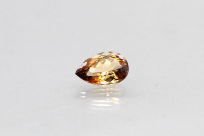 null Smoked topaz pear on paper.

Weight : 6.90 cts.