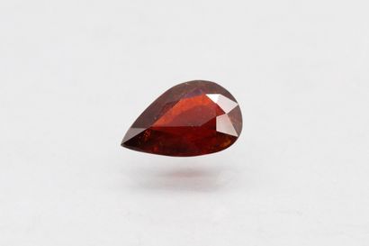 null Pear spessartite garnet on paper.

Weight : 8.19 cts.