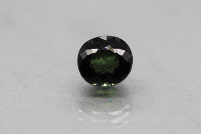 Oval green tourmaline on paper.

Weight :...