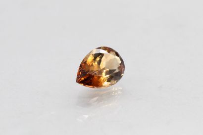 null Smoked topaz pear on paper.

Weight : 6.90 cts.