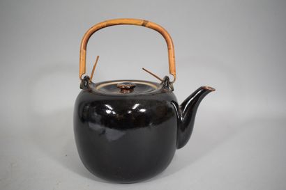 null Black and brown glazed stoneware teapot, bamboo handle. 

China, 20th century

H.:...