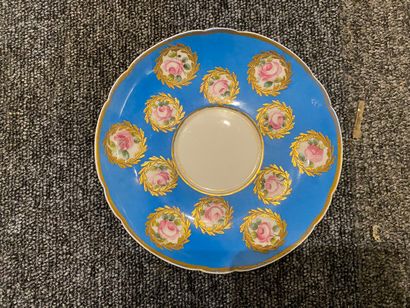 null Lot including:

- Paris porcelain cup and saucer decorated with roses on a blue...