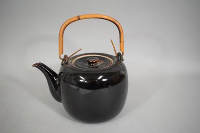 null Black and brown glazed stoneware teapot, bamboo handle. 

China, 20th century

H.:...