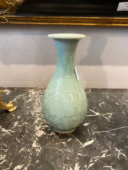 null Small celadon stoneware piriform vase decorated with friezes of lotus flowers.

China,...