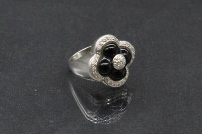 null Set in 14k (585) white gold stylizing flowers adorned with diamonds and onyx,...
