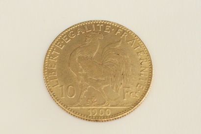 null Gold coin of 10 Francs with rooster (1900). 

Weight : 3.22 g.