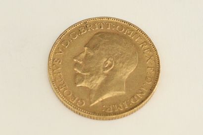A gold coin of 1 sovereign George V. South...