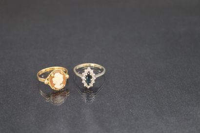 null 18k (750) gold lot comprising: 

- an 18k (750) white gold ring set with a navette...