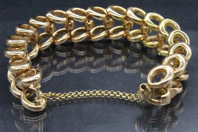 null Rigid articulated bracelet in yellow gold 14k (585).

Length : 24 cm ; Weight...
