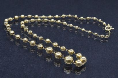 null Necklace in yellow gold 18K (750) formed of balls in fall.

Marked with an eagle...