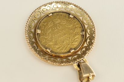 null Gold coin of 20 Francs Napoleon III bare head (1856) mounted in a corolla pendant....