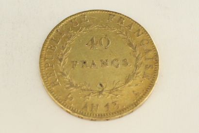 null Une pièce en or de 40 francs Napoléon tête nue, calendrier révolutionnaire

AN...