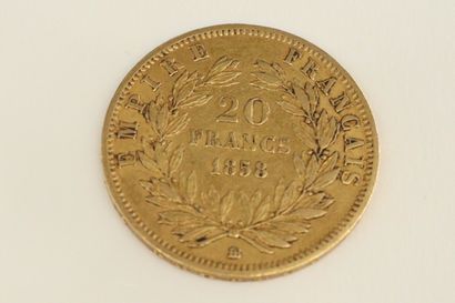 null Gold coin of 20 Francs Napoleon III bare head (1858).

Weight : 6.43 g.
