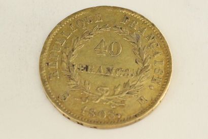 null Une pièce en or de 40 francs Napoléon tête laurée, République Française

1808...