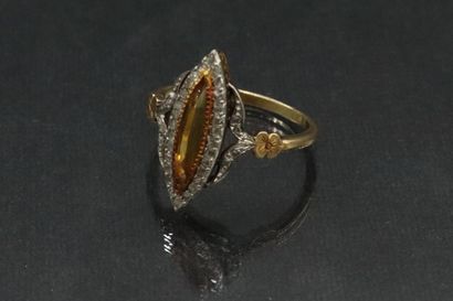 null Yellow and white gold ring 18K (750) with openwork setting and paved with diamonds...