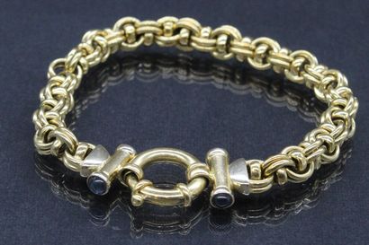 null Bracelet en or jaune 18K (750) à double maille forçat sertie de petits saphirs.

Poinçon...