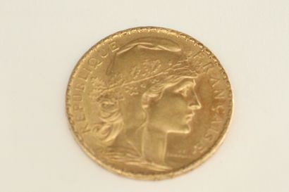null A gold coin of 20 Francs au Coq 1906.

Weight : 6.45g.