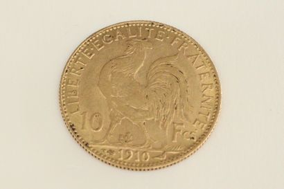 null Gold coin of 10 Francs with rooster (1910). 

Weight : 3.23 g.