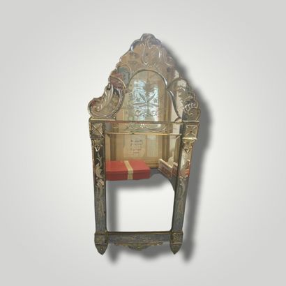 null Venetian mirror of rectangular form with pediment decorated in its center of...