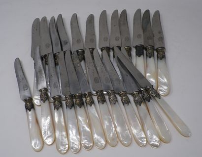 null 
Suite of twelve knives and twelve fruit knives, the bolsters with rocaille...