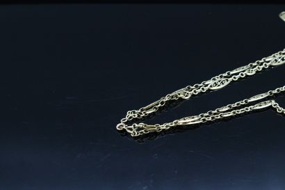 null Double necklace in 18K (750) yellow gold with filigree shuttle link. 

Around...