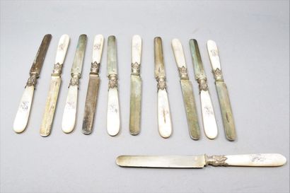 null Eleven fruit knives, the blades in silver (Minerve), the handles in mother-of-pearl,...