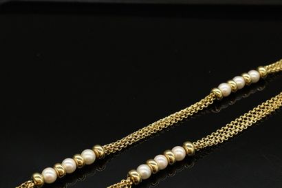 null Necklace in 18k (750) yellow gold made up of three rows of jaseron mesh alternating...