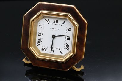 null CARTIER

Table clock making a shape alarm clock

octagonal form in gilded metal...