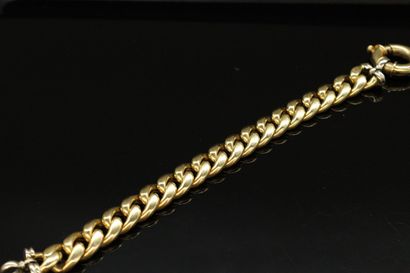 null Bracelet with curb chain in 18k (750) yellow and white gold. 

Wrist size :...