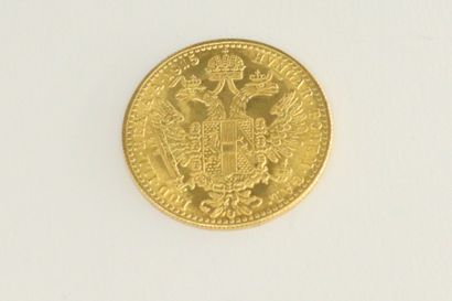 null Pièce en or d'un ducat François Joseph (1915).

Poids : 3,49 g.
