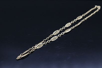 null 18K (750) yellow gold chain with alternating rings.

Around the neck : 40 cm....