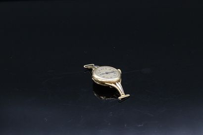 null Part of a watch in 18K (750) yellow gold.

Dial gold background, Arabic numerals...