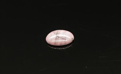 null Rhodonite cabochon on paper. 

Weight : approx. 9.25 cts.