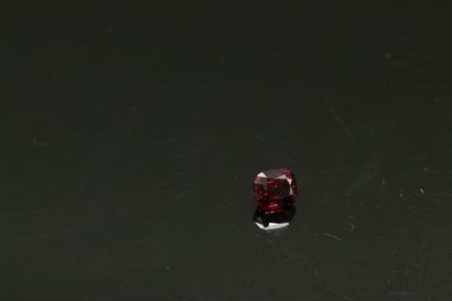 null Cushion red spinel on paper. 

Weight : 2.06 cts