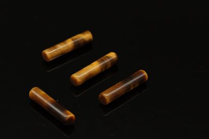 null Double pairing of tiger eye stick size. 

4 pieces

Weight : 18.05 cts.